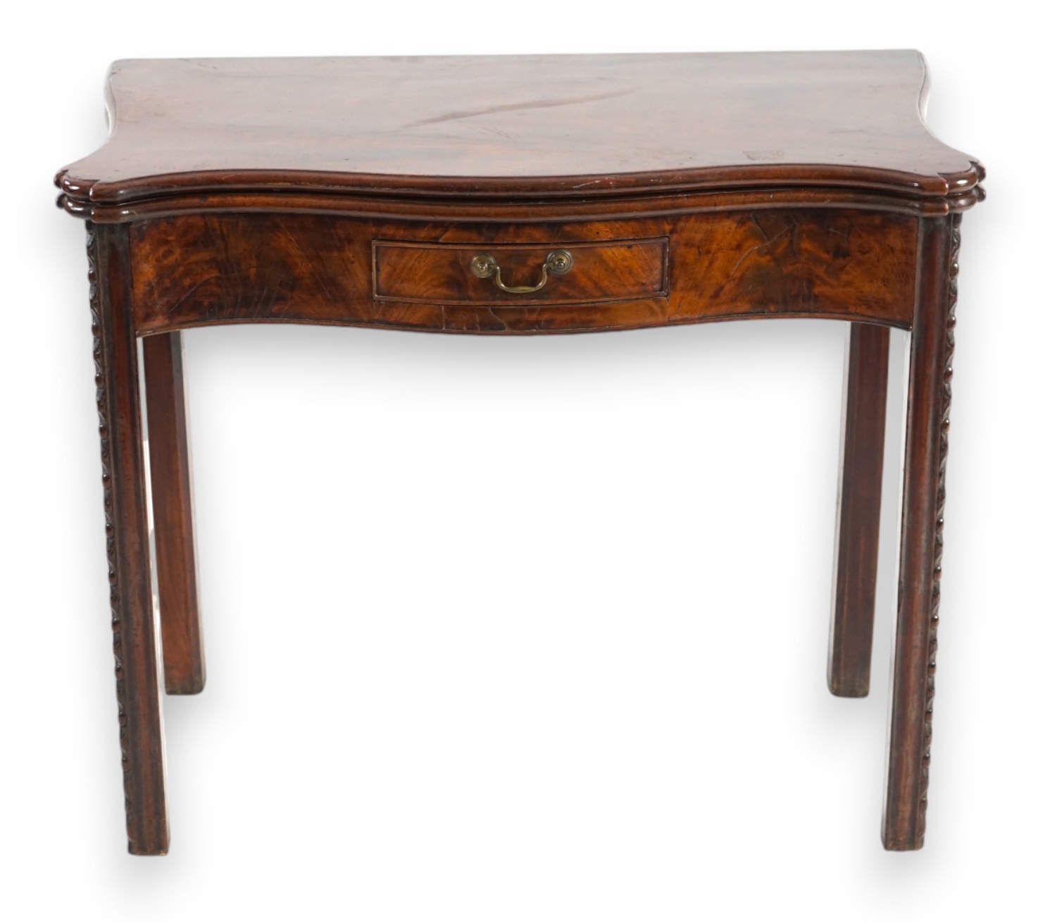 A George III serpentine mahogany tea table